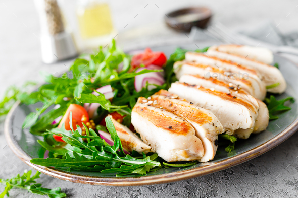 Chicken fillet salad with fresh vegetables and arugula - Stock Photo - Images