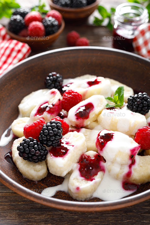 Lazy dumplings, vareniki with fresh berries. Boiled cottage cheese gnocchi with berries - Stock Photo - Images