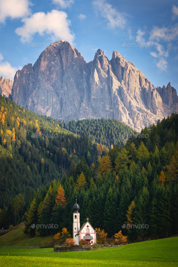 Ranui church in front of Dolomites mountain in autumn - Stock Photo - Images