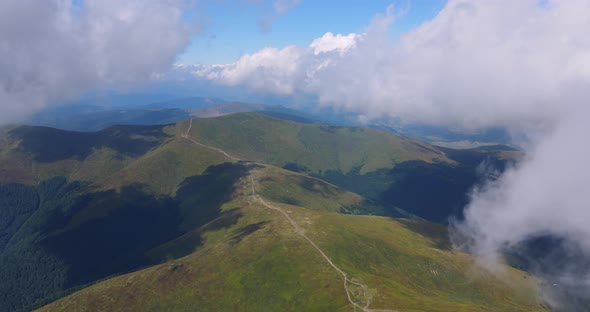 Flight Over Mountains Covered With Dense Forests And Thick Fog