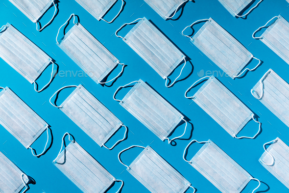 Medical masks on blue background. Face mask protection, virus, flu, coronavirus, COVID-19 - Stock Photo - Images