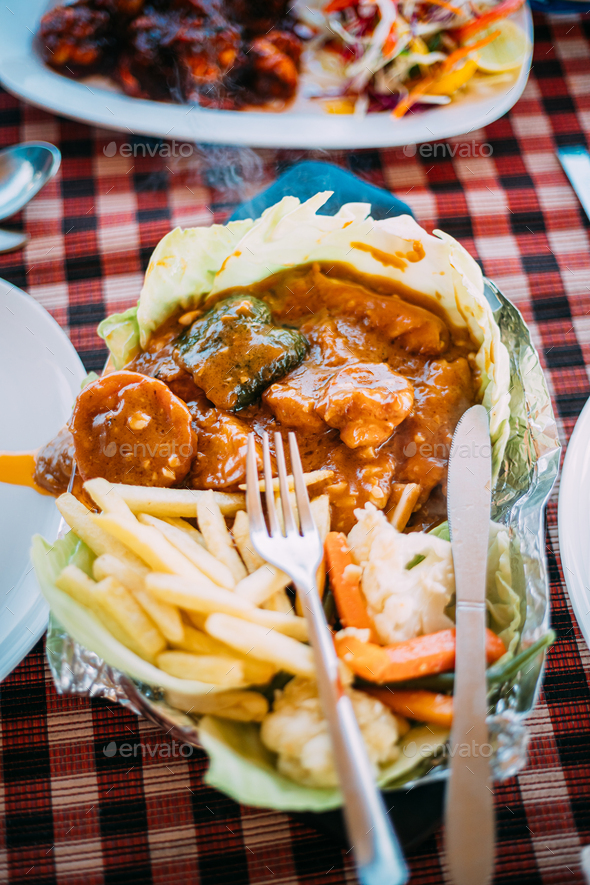 Goa, India. Dish Of Indian National Cuisine Is Sizzler, Which Consist Of French Fries, Fried Shrimp - Stock Photo - Images