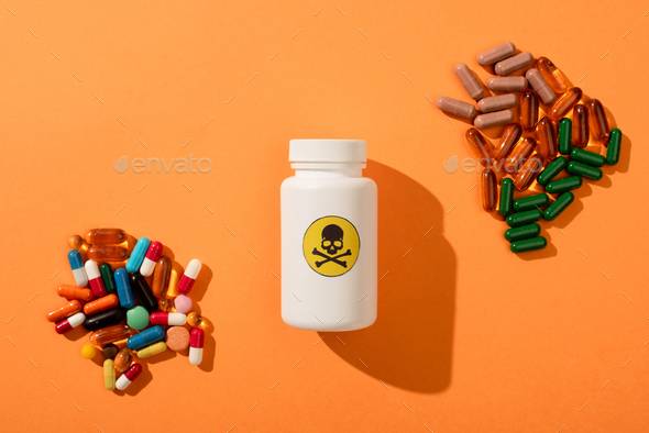 Top View of Container With Dangerous Poison And Dietary Supplements on Orange Background