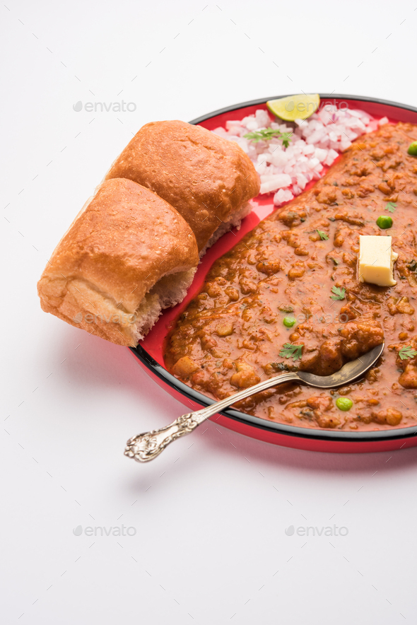 Pav bhaji is a popular Indian street food that consists of a spicy mix vegetable mash & soft buns - Stock Photo - Images