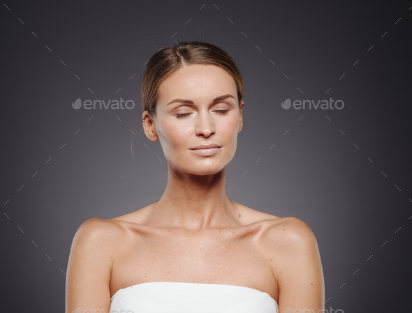 Beauty woman healthy skin natural makeup face close up. Portrait view.