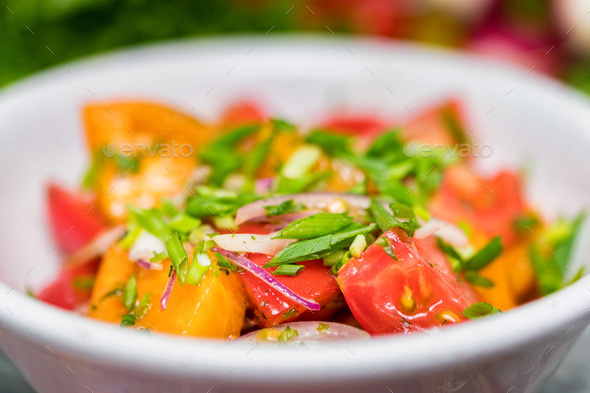 Fresh rustic vegetable salad on rustic background - Stock Photo - Images