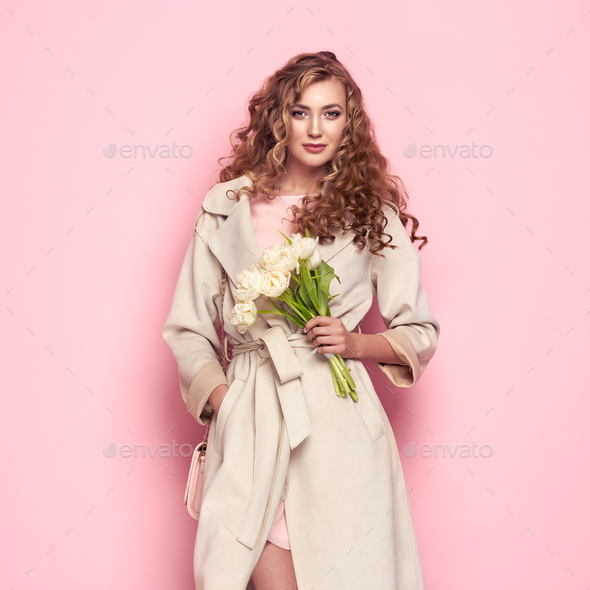 Young woman in white spring coat - Stock Photo - Images