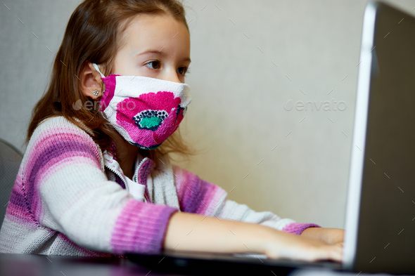 Schoolgirl studying at home with a notebook and doing school homework. - Stock Photo - Images