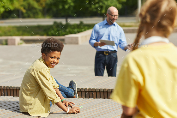 Boy Looking at Friends during Outdoor Lesson