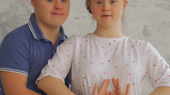 Happy Teenage Couple with Down Syndrome