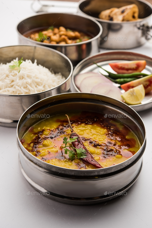Indian Veg Lunchbox for office of workplace with chole, dal fry rice and chapati - Stock Photo - Images