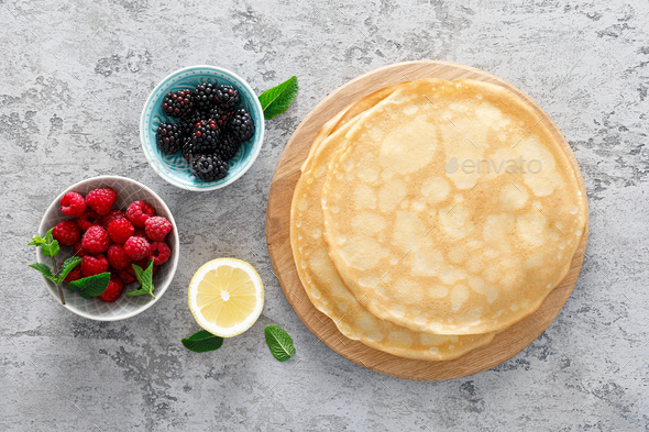 9d1a9594Thin crepes with fresh berries and lemon zest. Pancakes with raspberry and blackberry.