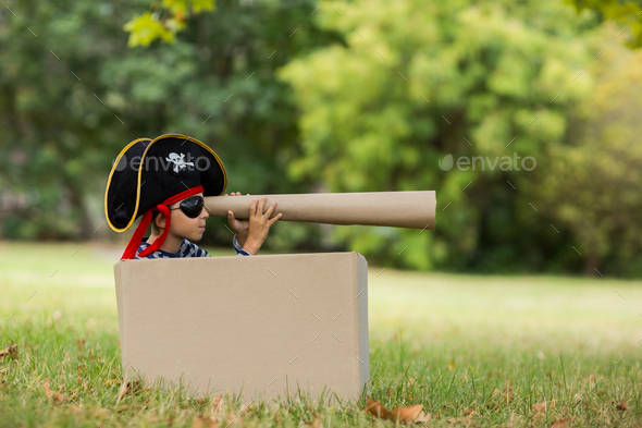 Boy pretending to be a pirate - Stock Photo - Images