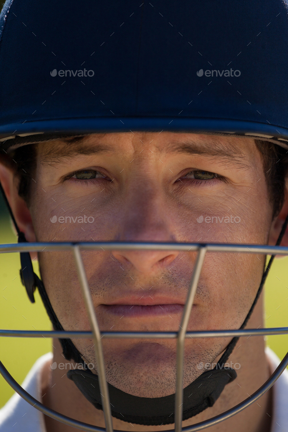 Close up portrait of cricket player wearing helmet Stock Photo by