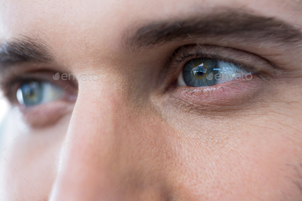 Close-up Shot Of Man's Eye. Man With Blue Eyes. Stock Photo