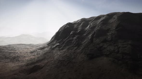 Sun Rays Over Mountains in a Valley alt