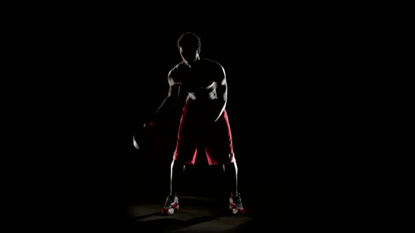 Man Play Basketball Isolated on Black alt