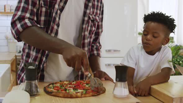 Father and son cooking together alt