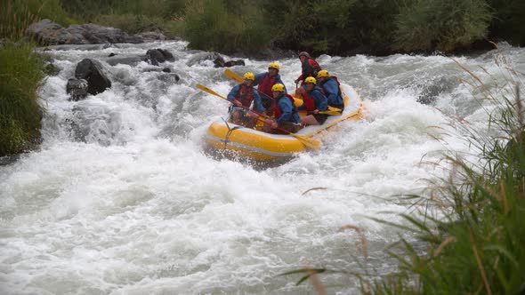 Super slow motion shot of group of people white water rafting, shot on Phantom Flex 4K