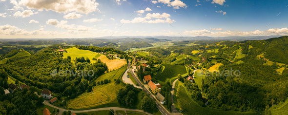 Aerial panorama of of green hills and vineyards with mountains in background. Austria vineyards - Stock Photo - Images