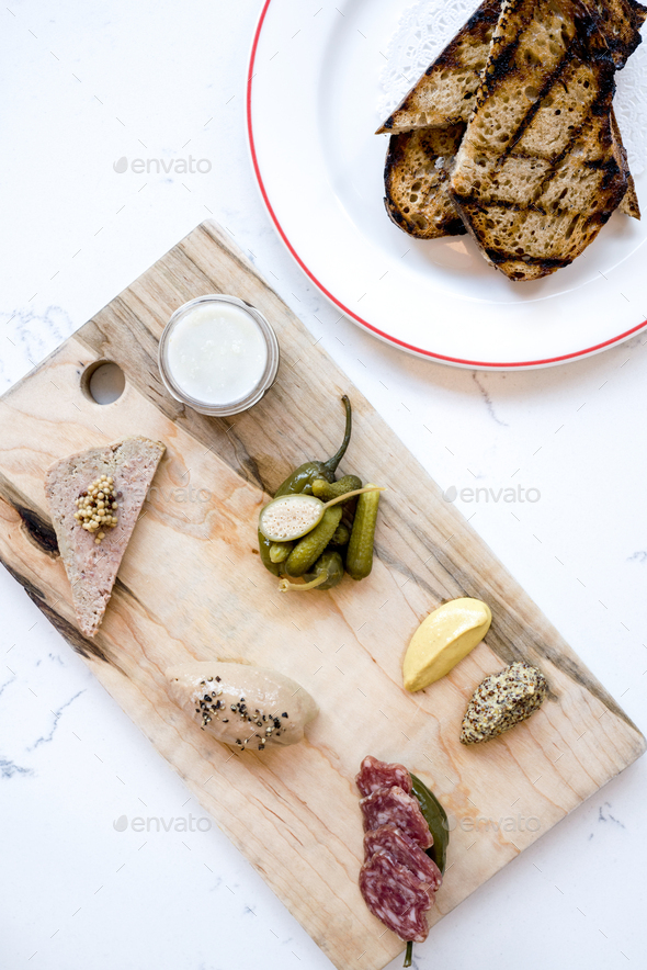 French charcuterie board with pickles, capers and mustard Stock Photo