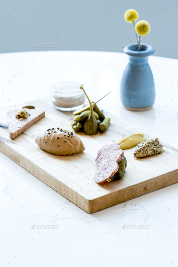 French charcuterie board with pickles, capers and mustard Stock Photo