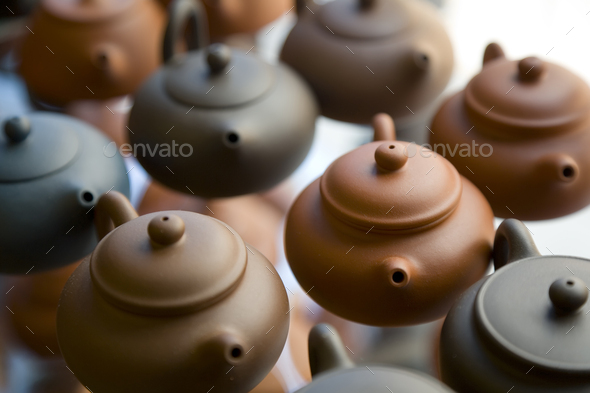 High angle close up of traditional brown clay teapots.