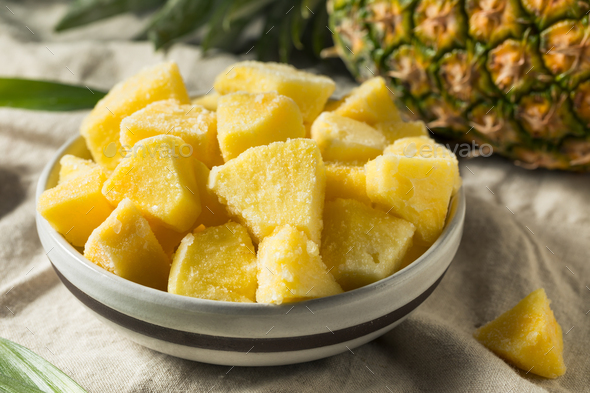 Yellow Organic Frozen Pineapple Stock Photo by bhofack2