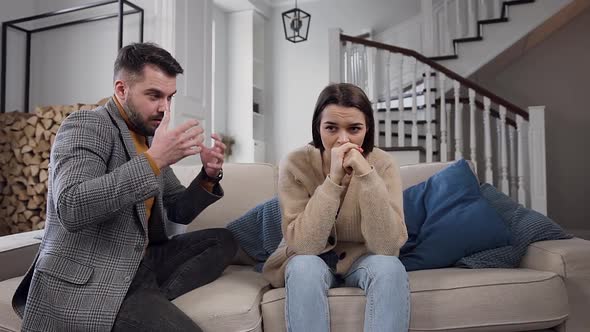 Woman  with Her Husband on the Couch and Listening How He Complaining on His Life with Her alt