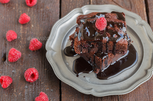 Chocolate brownie with raspberries.