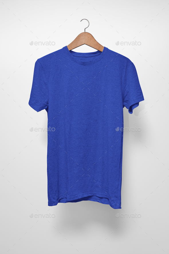 Dark blue T-Shirt on a hanger against a white background - Stock Photo - Images