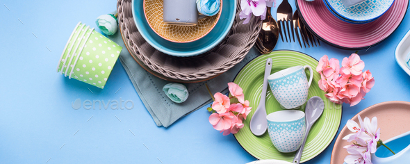 Tableware dish set on blue pastel background