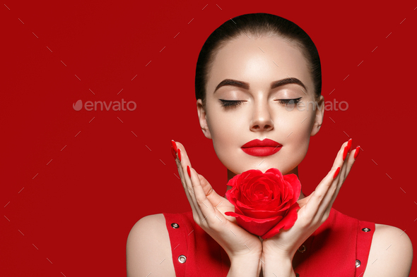Beautiful curle hair female in red with red lips and dress manicure, beauty  rose afro hairstyle Stock Photo by kiraliffe