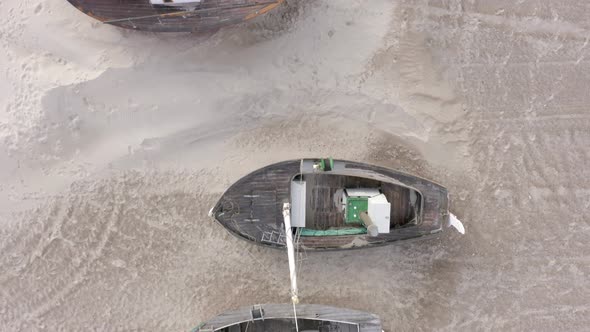 Old Fishing Boats Ashore on Thorup Strand Beach in Denmark alt