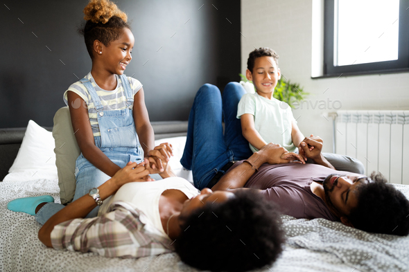Happy african family enjoying spending time together at home