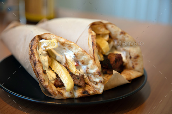 Gyro pita, shawarma, take away, street food. Traditional greek turkish meat food