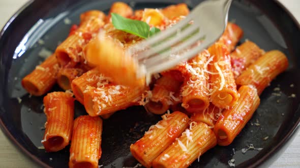 Rigatoni pasta with tomato sauce and cheese - traditional Italian pasta alt