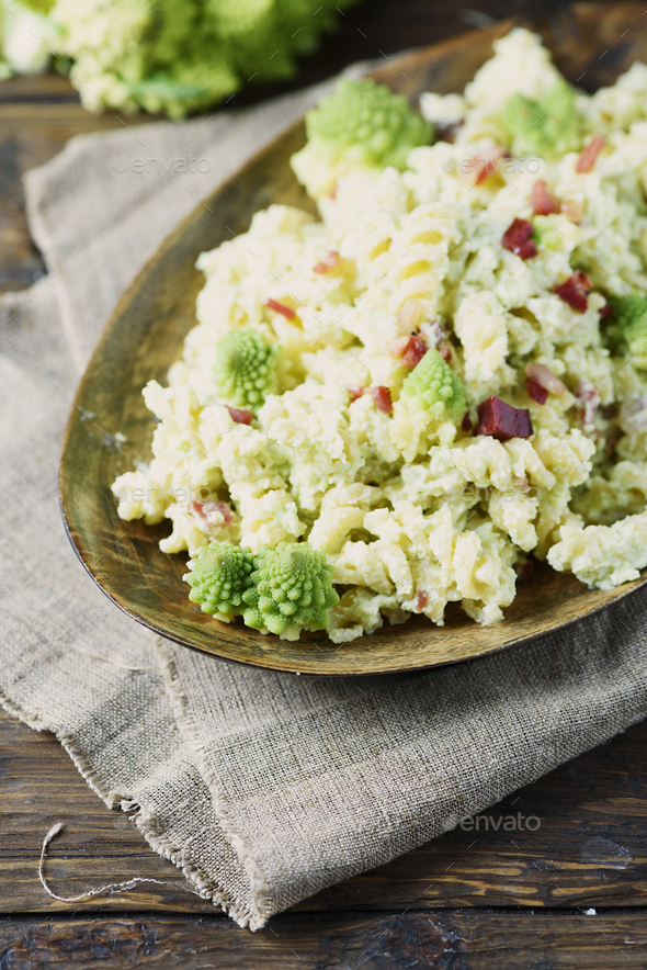 Pasta with Roman cauliflower, ricotta and ham Stock Photo by