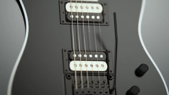 Modern six-string electric guitar on a concrete. Contemporary music instrument. alt