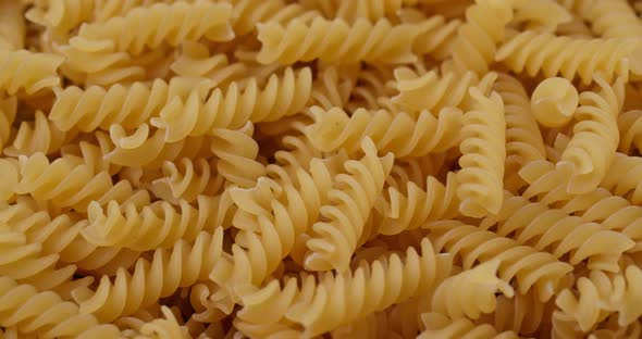 Dry uncooked fusilli close up alt