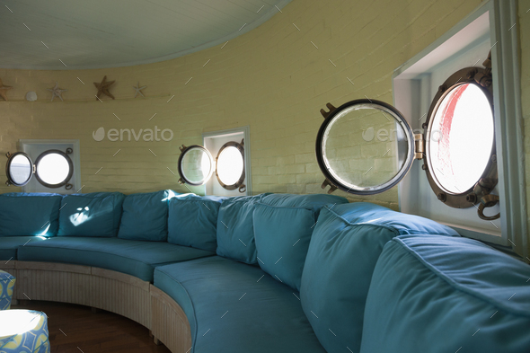 54373,Port hole windows in round lighthouse living room