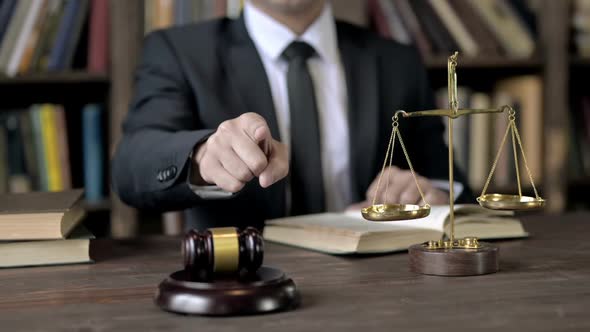 Close Up Shoot of Judge Hand Pointing Finger on Camera alt