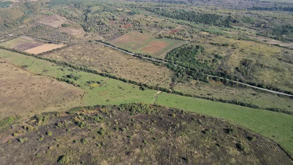 Aerial view on of autumn fields with countryside farmland alt