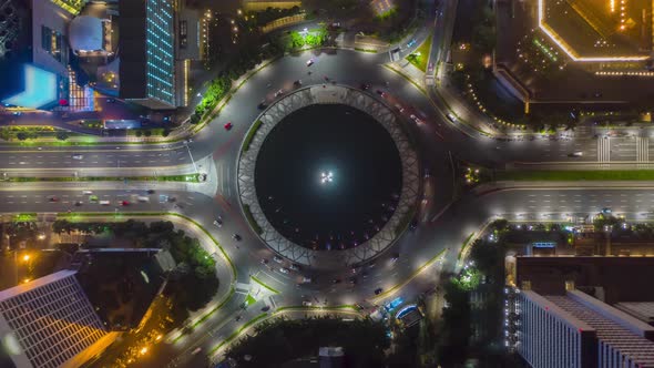 Aerial Birds Eye Overhead Top Down View Hyperlapse of Busy Car Traffic on Roundabout Around Selamat alt