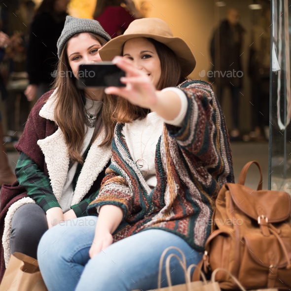 Women taking selfies Stock Photo by TrendsetterImages | PhotoDune