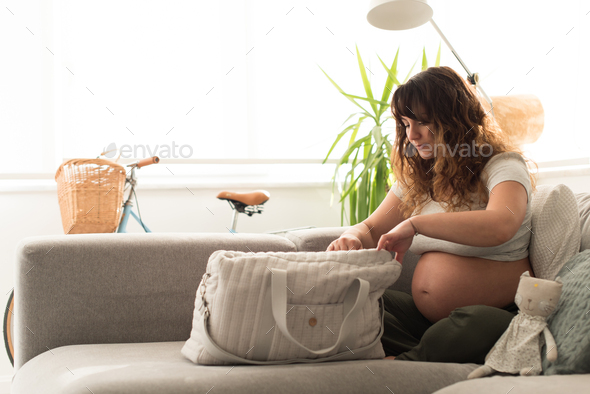 Mother organizing maternity bag