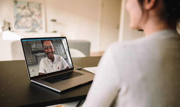 Couple having video call on laptop - Stock Photo - Images