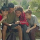 Multiracial College Students with Tablet Pc Checking Exam Results on Bench - VideoHive Item for Sale