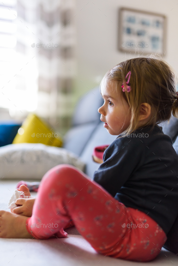 Two year old girl with big eyas portrait, Indoor shoot with natural light