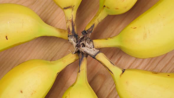 Bananas Forming A Circle On Cutting Board Spinning 02